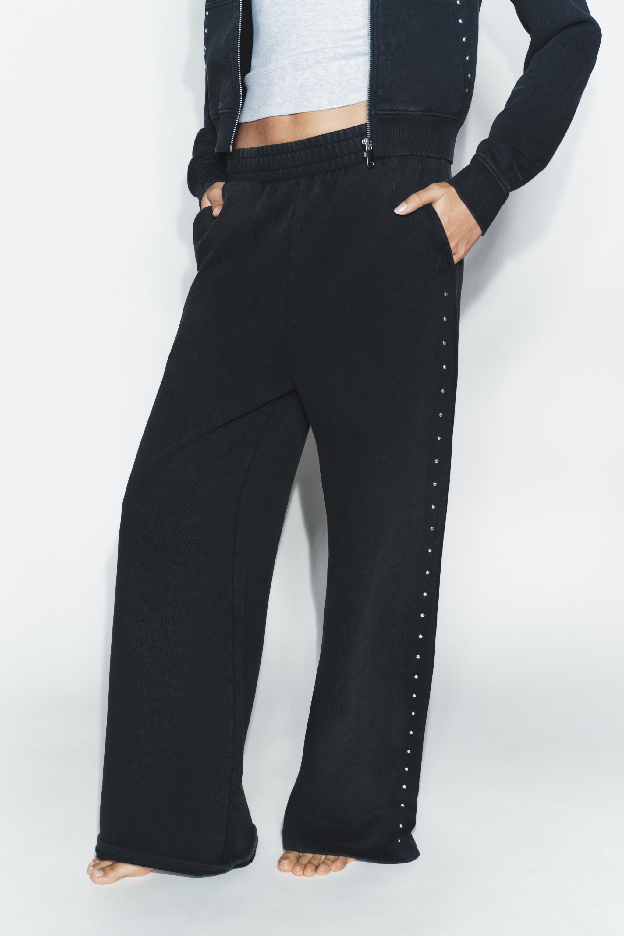 WASHED EFFECT FLEECE PANTS WITH STUDS